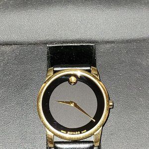 GENTLY USED, 2012 MOVADO BLACK AND GOLD EDITON WRIST WATCH!!!